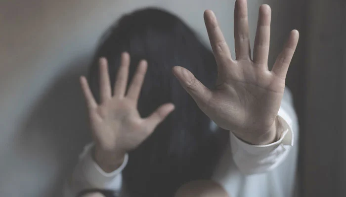 Blackmailing and harassing women